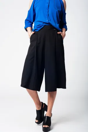 Black pants skirt with silver buttons
